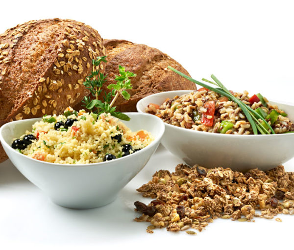 Bread and various whole grains in bowls.